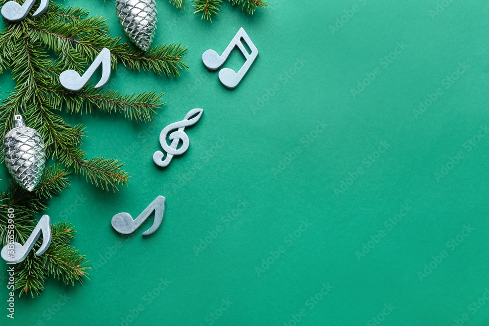 Note signs and Christmas decor on color background