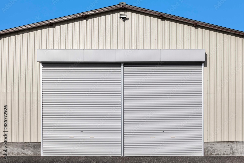 A white shutter door close at an industrial warehouse