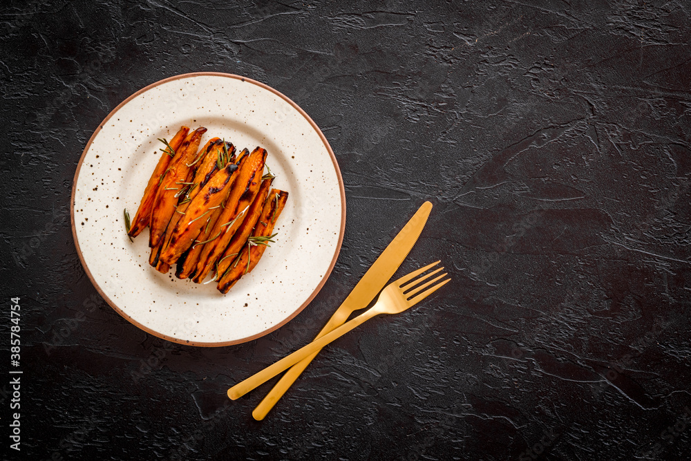 Top view of sweet potato fries with herbs and spices