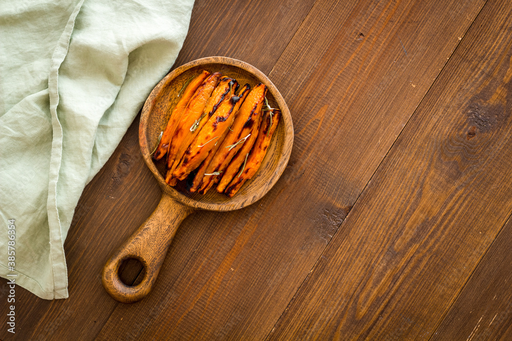 Overhead view of sweet potato fries with spices and herbs