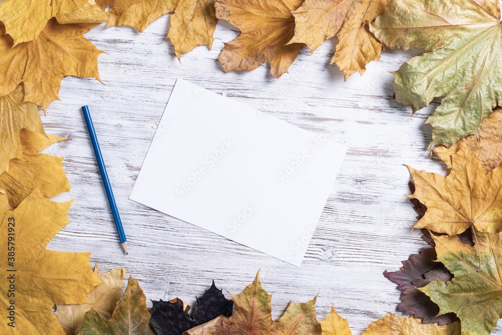 White paper sheet and pencil lies on desk