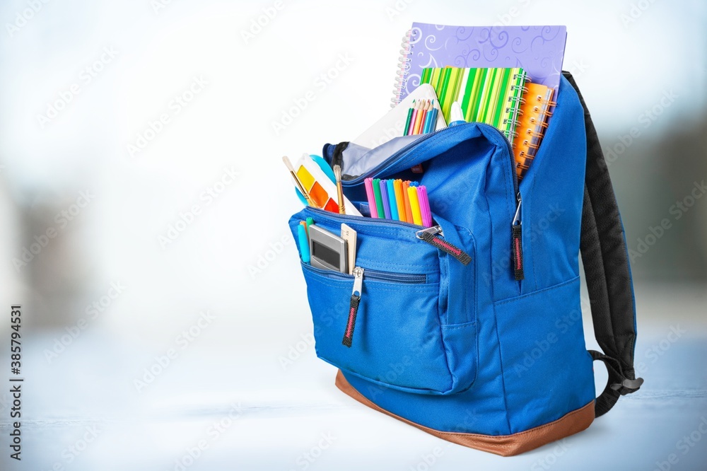 Colored school backpack with school supplies