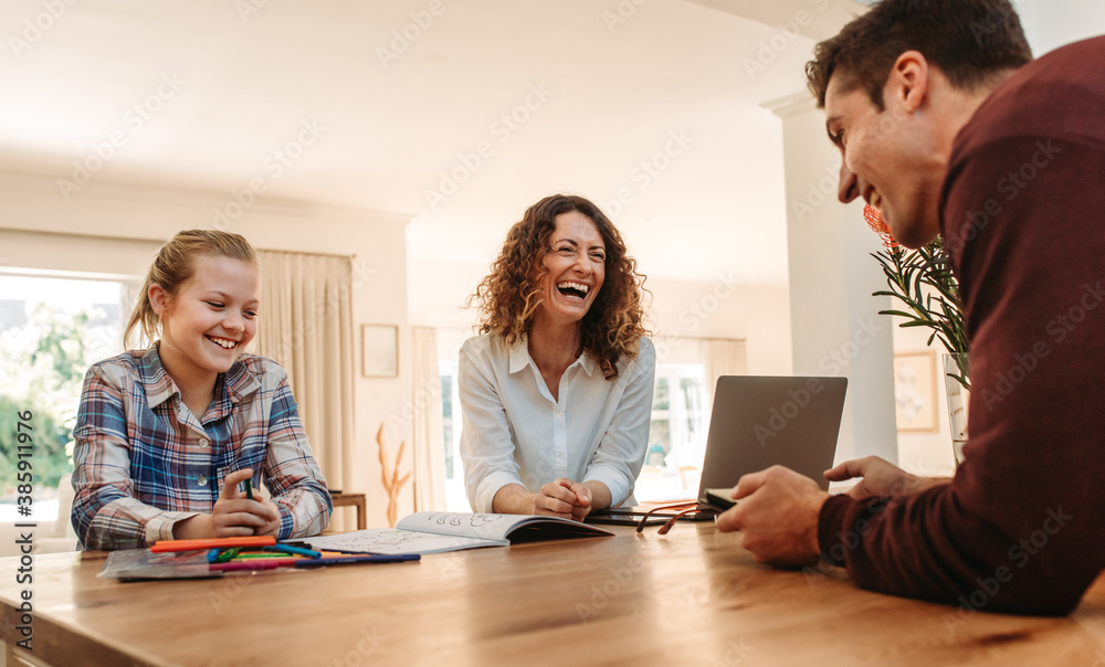 Smiling family together at home