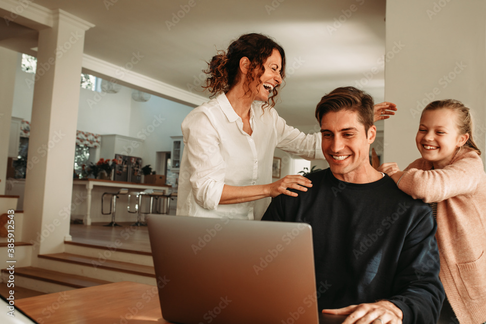 Happy family at home making video call