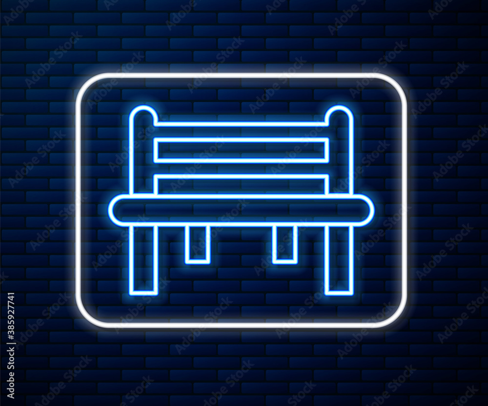 Glowing neon line Romantic bench icon isolated on brick wall background. Vector.