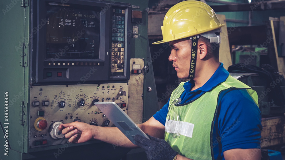 Smart factory worker using machine in factory workshop . Industry and engineering concept.