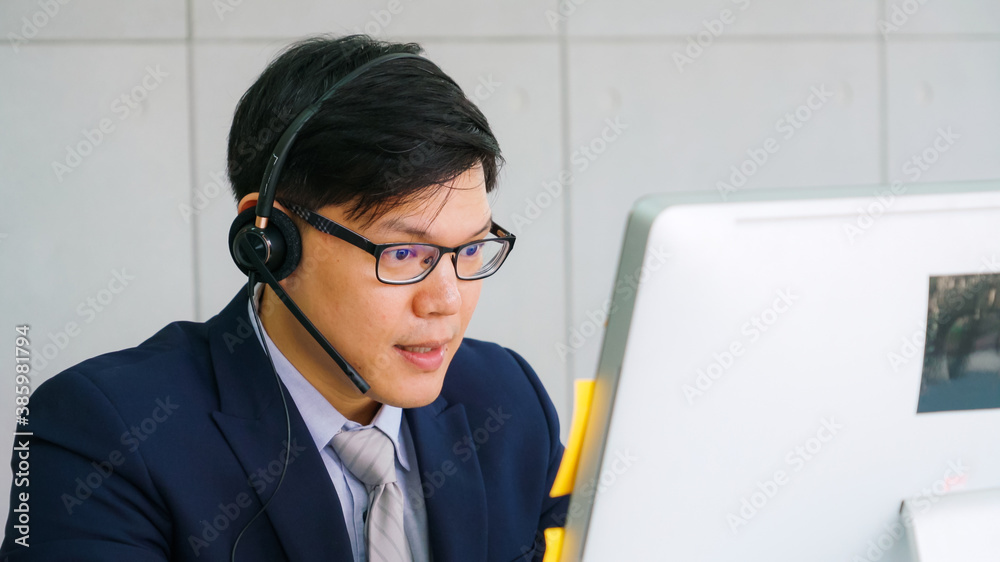 Business people wearing headset working in office to support remote customer or colleague. Call cent