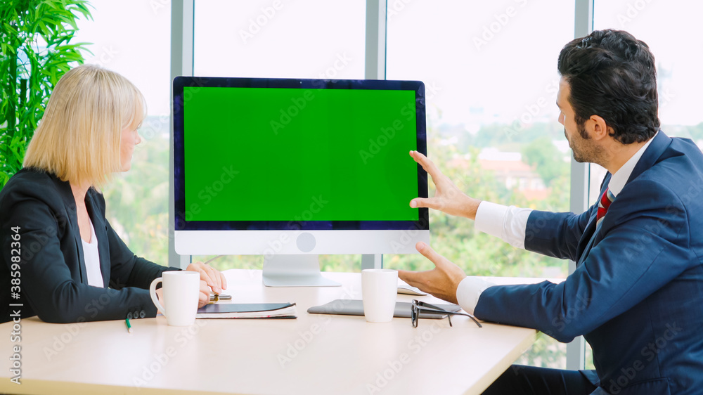 Business people in the conference room with green screen chroma key TV or computer on the office tab