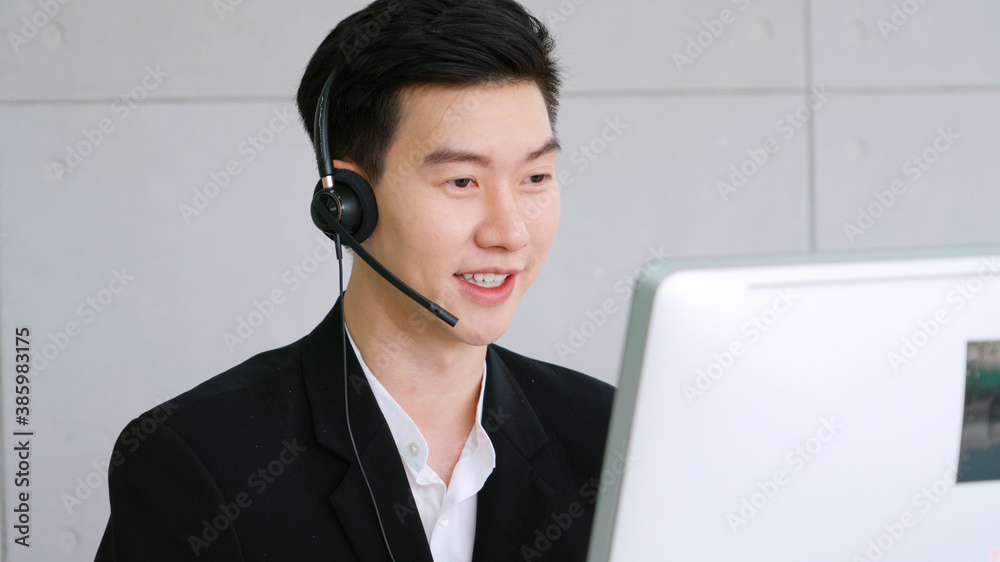 Business people wearing headset working in office to support remote customer or colleague. Call cent