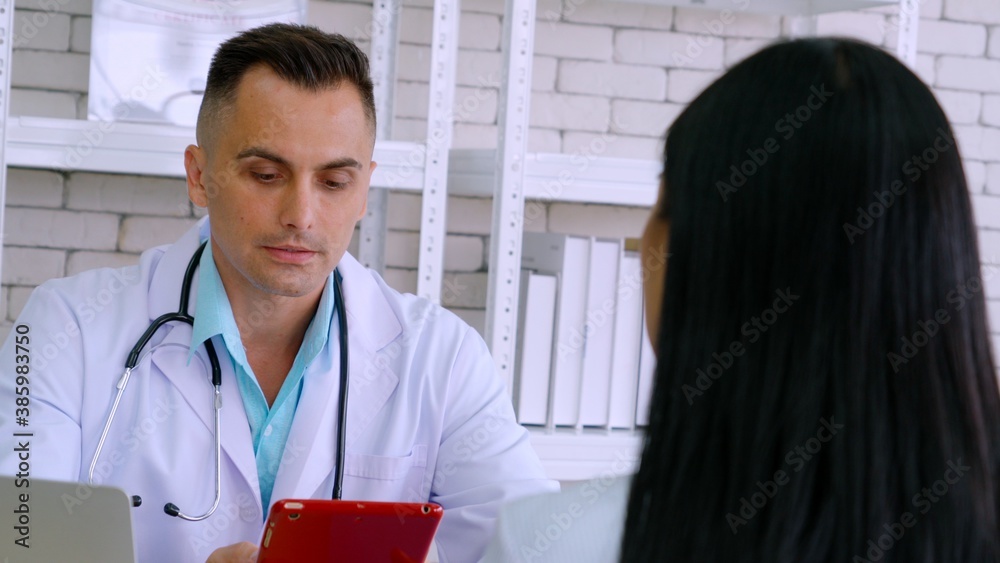 Doctor in professional uniform examining patient at hospital or medical clinic. Health care , medica