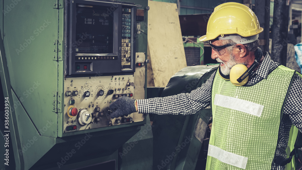 Smart factory worker using machine in factory workshop . Industry and engineering concept.