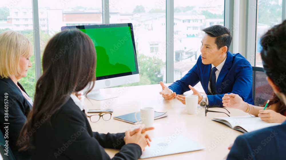 Business people in the conference room with green screen chroma key TV or computer on the office tab