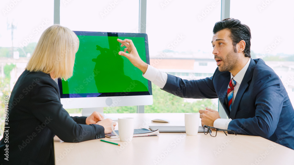 Business people in the conference room with green screen chroma key TV or computer on the office tab