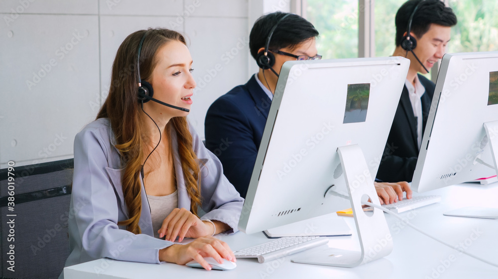 Business people wearing headset working in office to support remote customer or colleague. Call cent