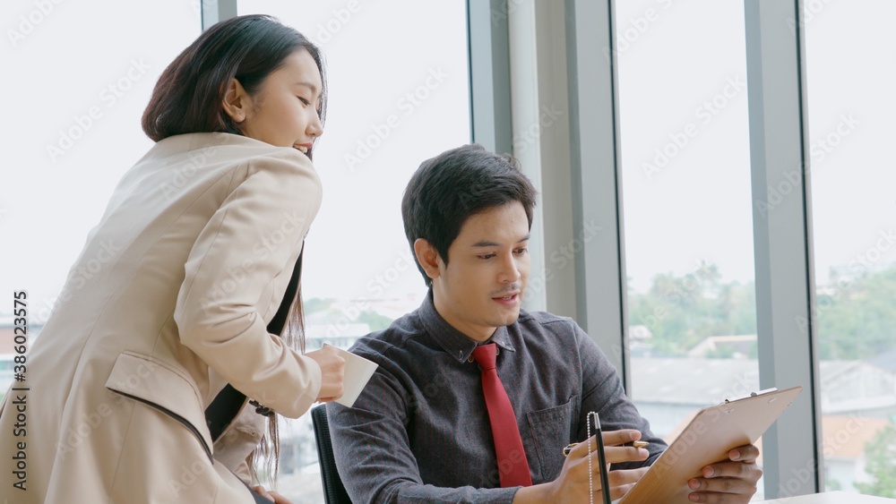 Two business people talk project strategy at office meeting room. Businessman discuss project planni