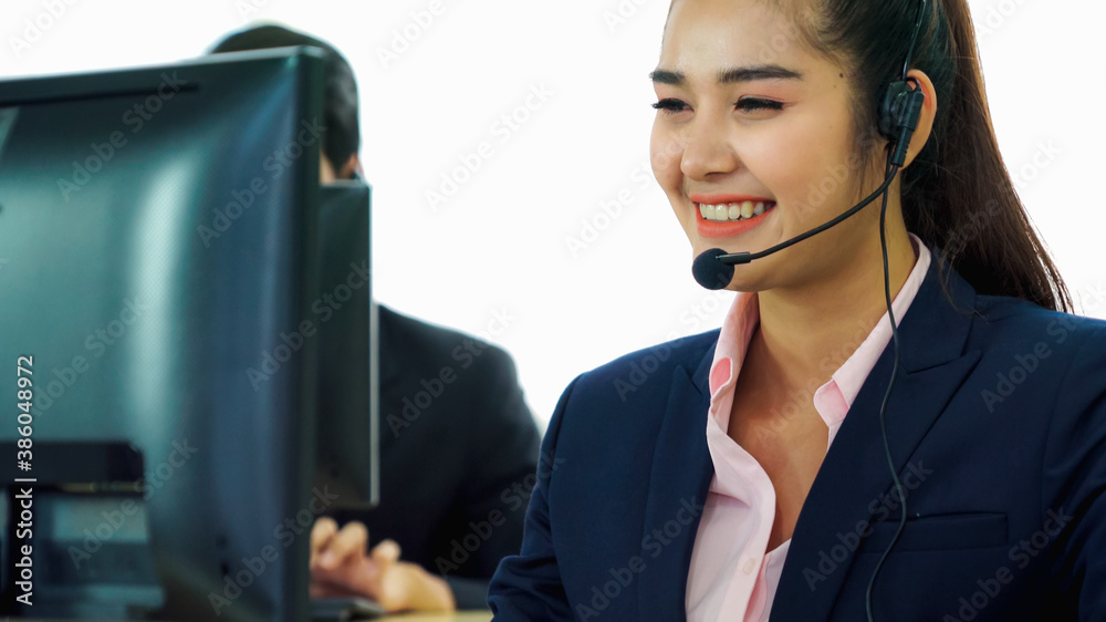 Business people wearing headset working in office to support remote customer or colleague. Call cent