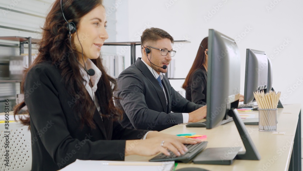 Business people wearing headset working in office to support remote customer or colleague. Call cent