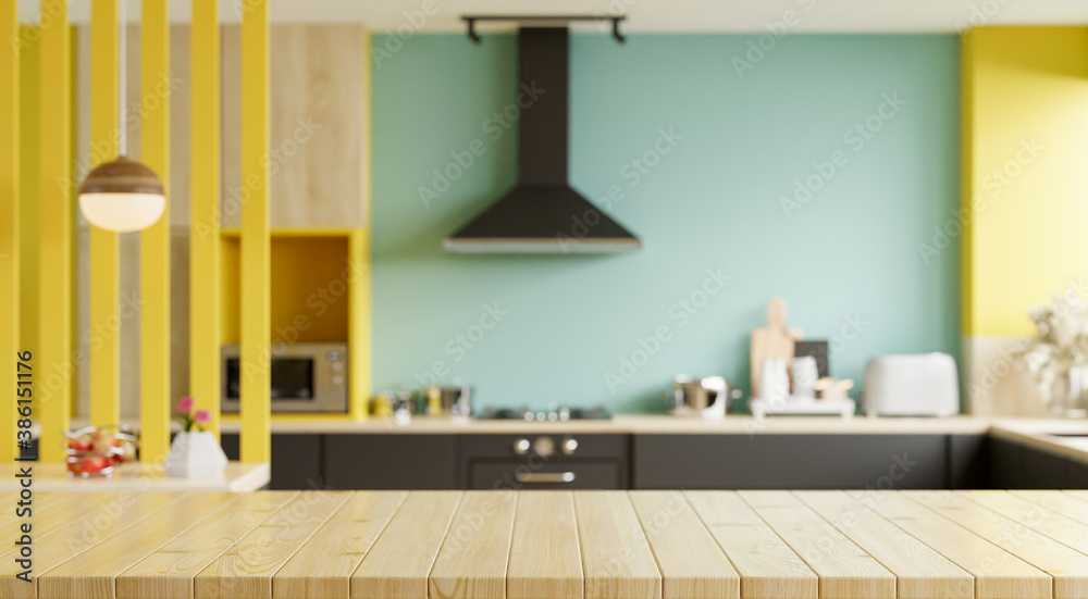 Empty wooden table and blurred kitchen yellow wall background/Wood table top on blur kitchen counter