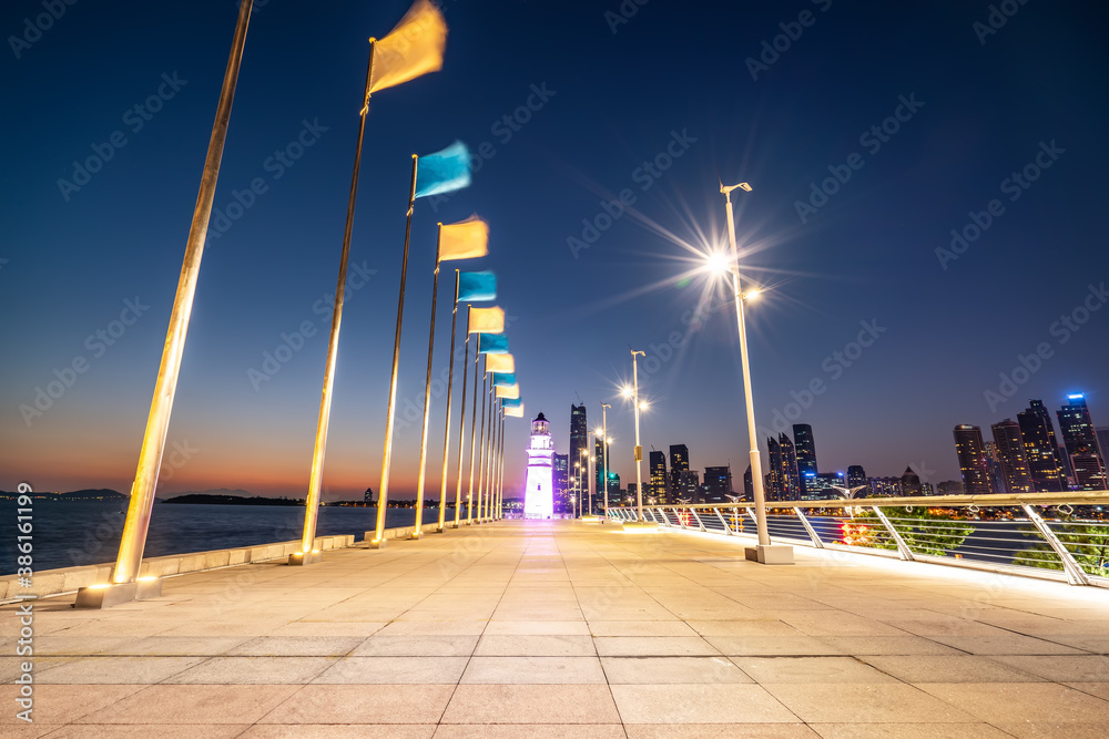 White lighthouse and urban architecture landscape night view