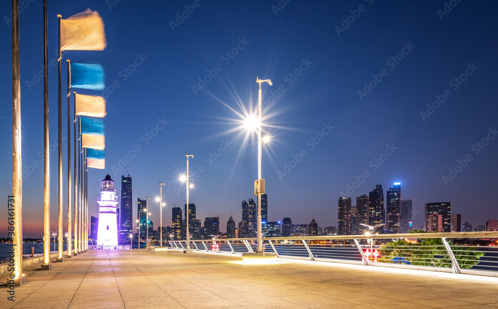 White lighthouse and urban architecture landscape night view