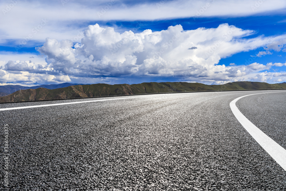 New asphalt road and mountain with sky cloud natural scenery.