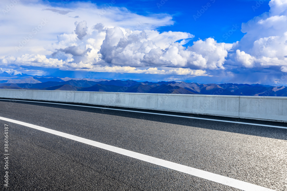 New asphalt road and mountain with sky cloud natural scenery.