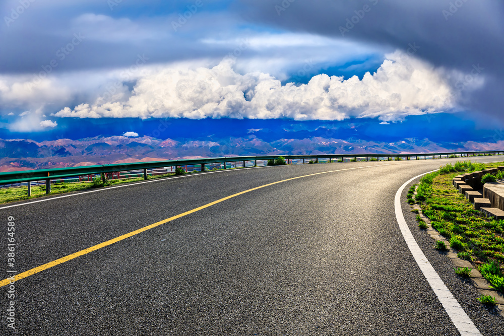 New asphalt road and mountain with sky cloud natural scenery.