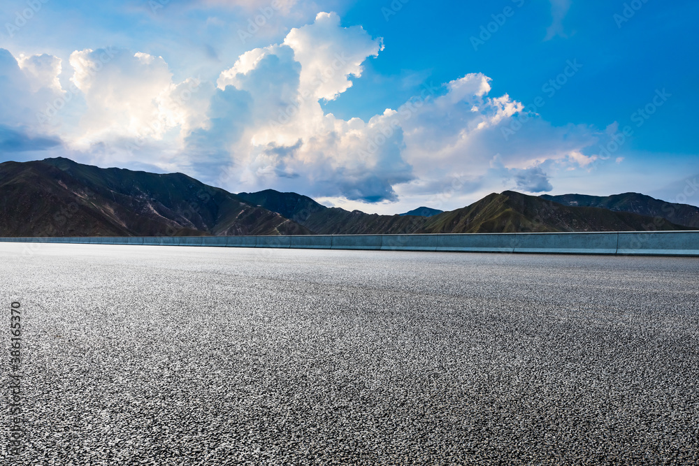 New asphalt road and mountain with sky cloud natural scenery.