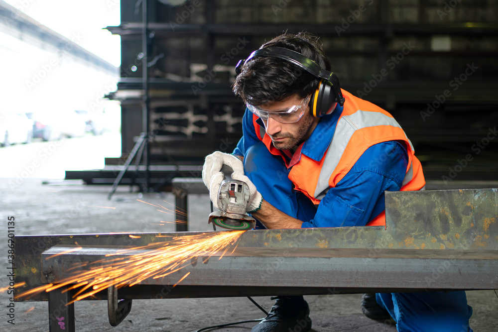 A male worker chia steel in an industrial factory. Concept industry.