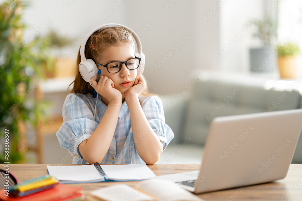 Girl doing homework or online education.