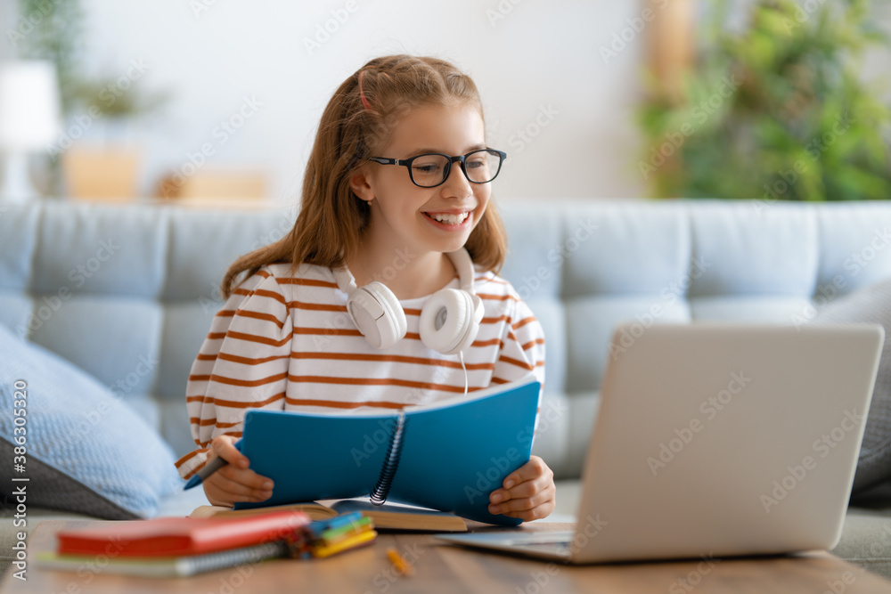 Girl doing homework or online education.