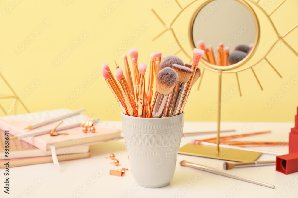 Set of makeup brushes on dressing table