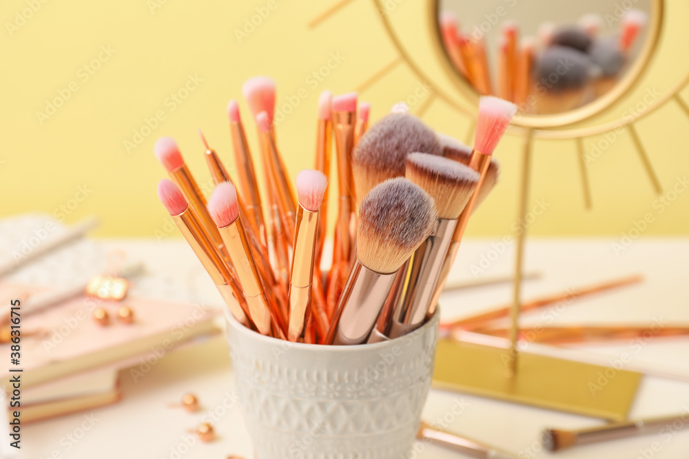 Set of makeup brushes on dressing table