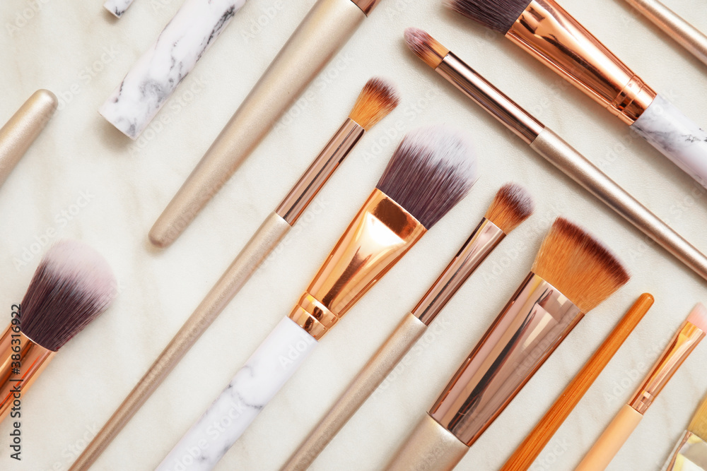 Set of makeup brushes on white background