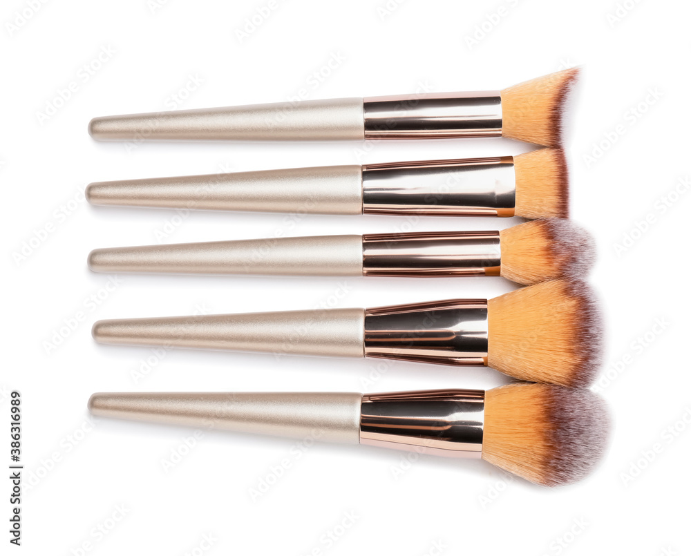 Set of makeup brushes on white background