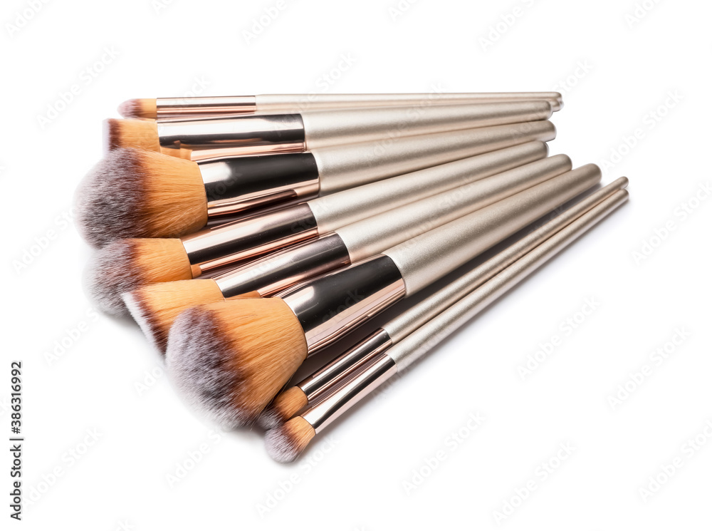 Set of makeup brushes on white background