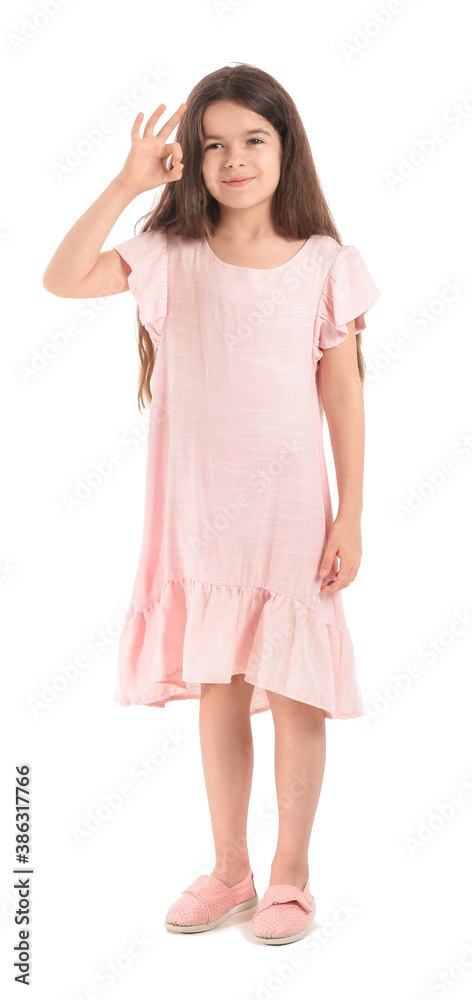 Cute little girl showing OK gesture on white background