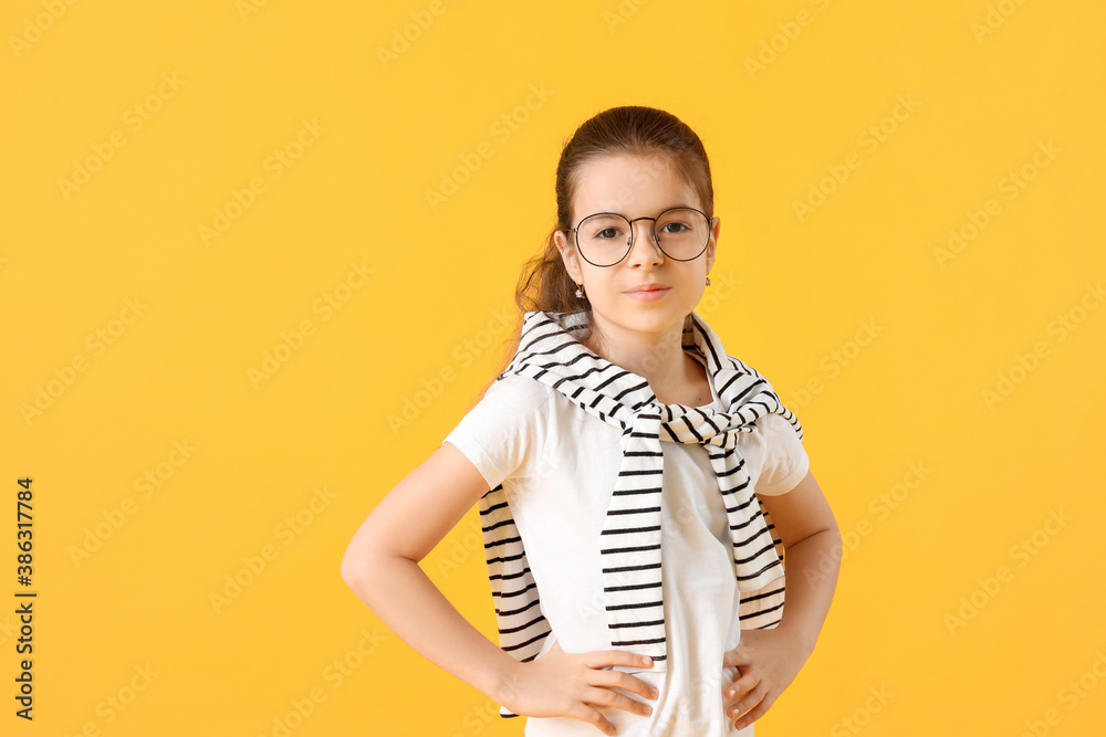 Cute little girl on color background