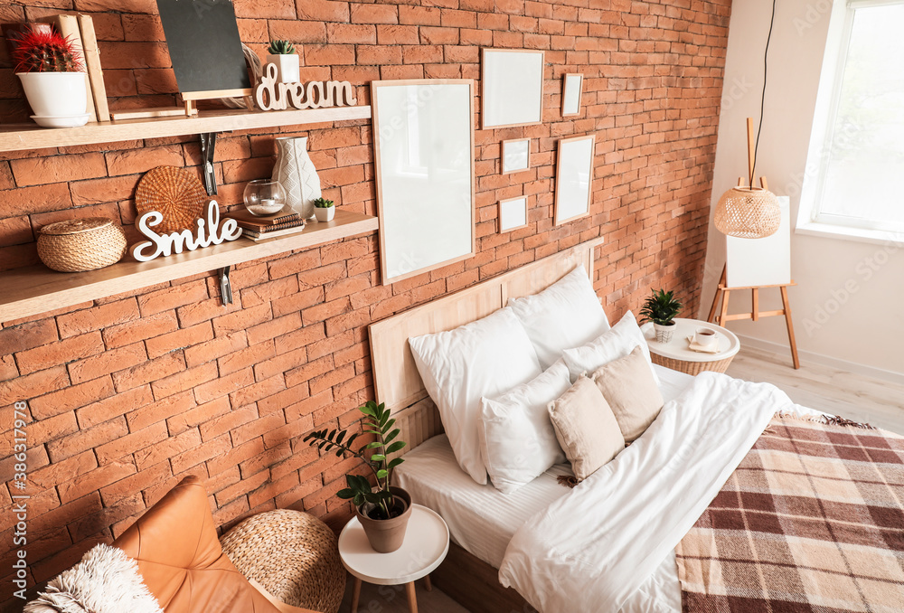 Interior of modern stylish bedroom with shelves