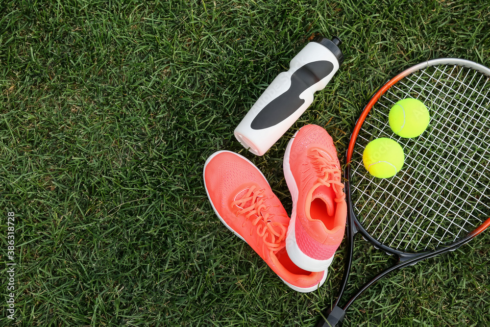 Set of sport equipment on green grass