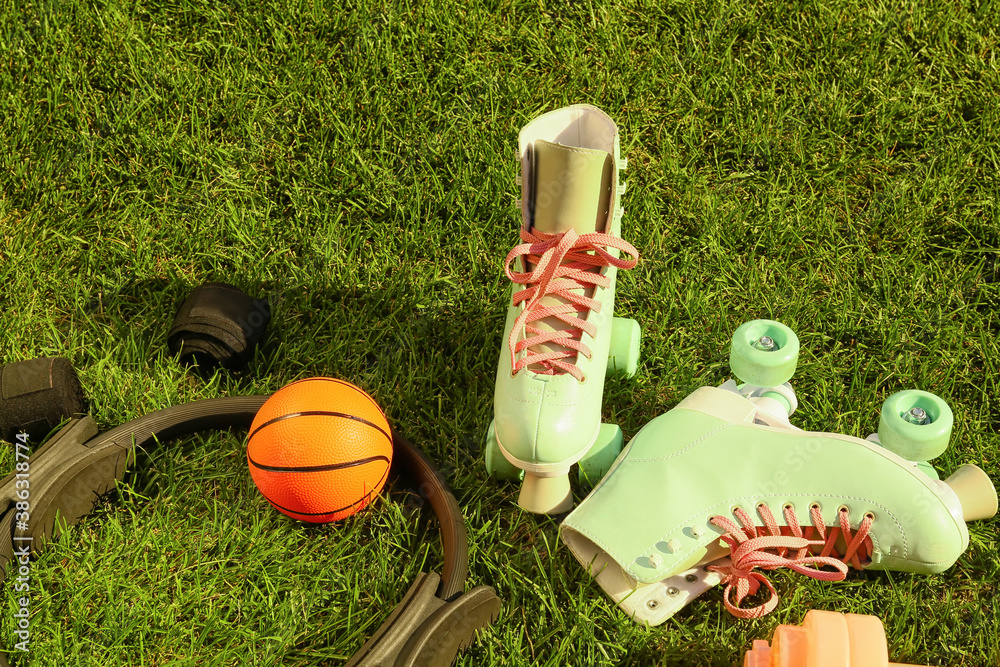 Set of sport equipment on green grass