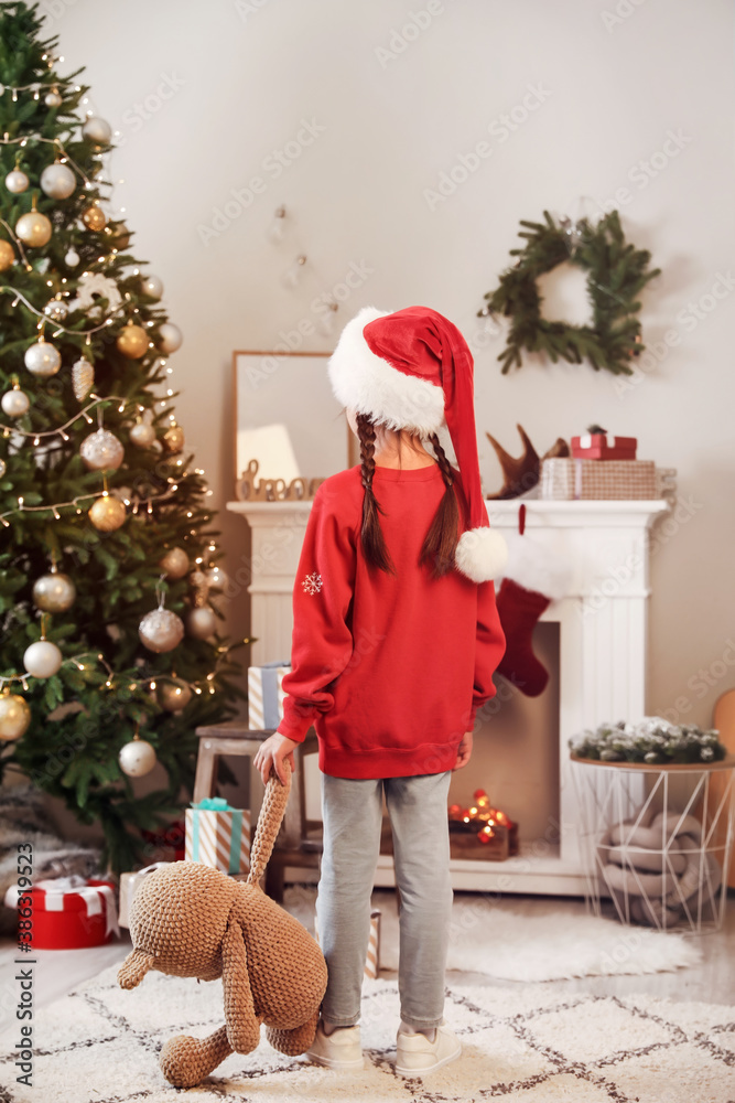 Cute little girl at home on Christmas eve