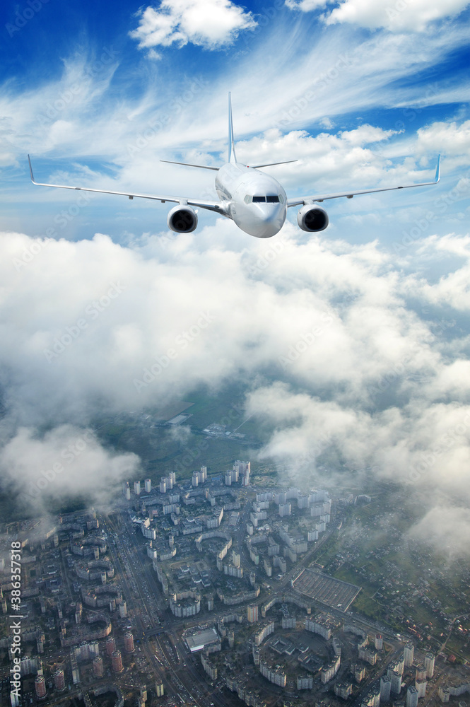 Airplane in the sky. Passenger Airliner in clouds.