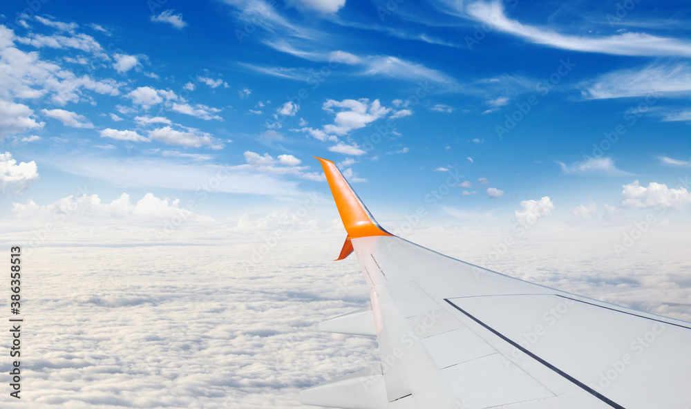 View from airplane window with blue sky