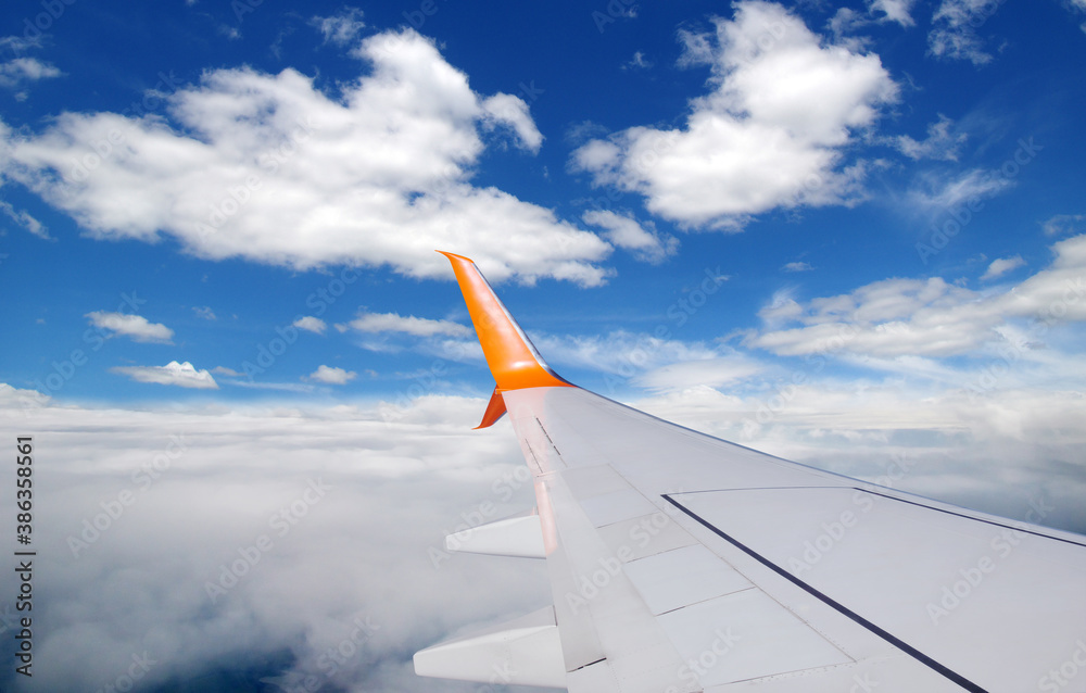 View from airplane window with blue sky