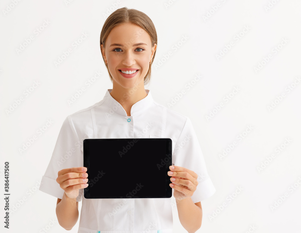 friendly doctor nurse with tablet wireless computer smiles in isolated against   white background