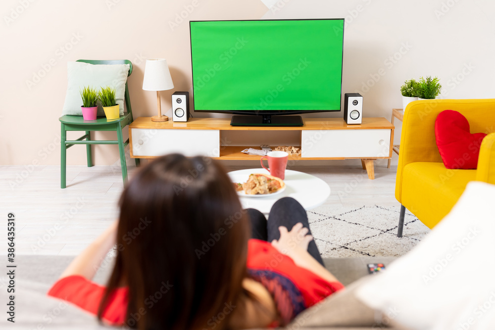 woman watch green screen TV