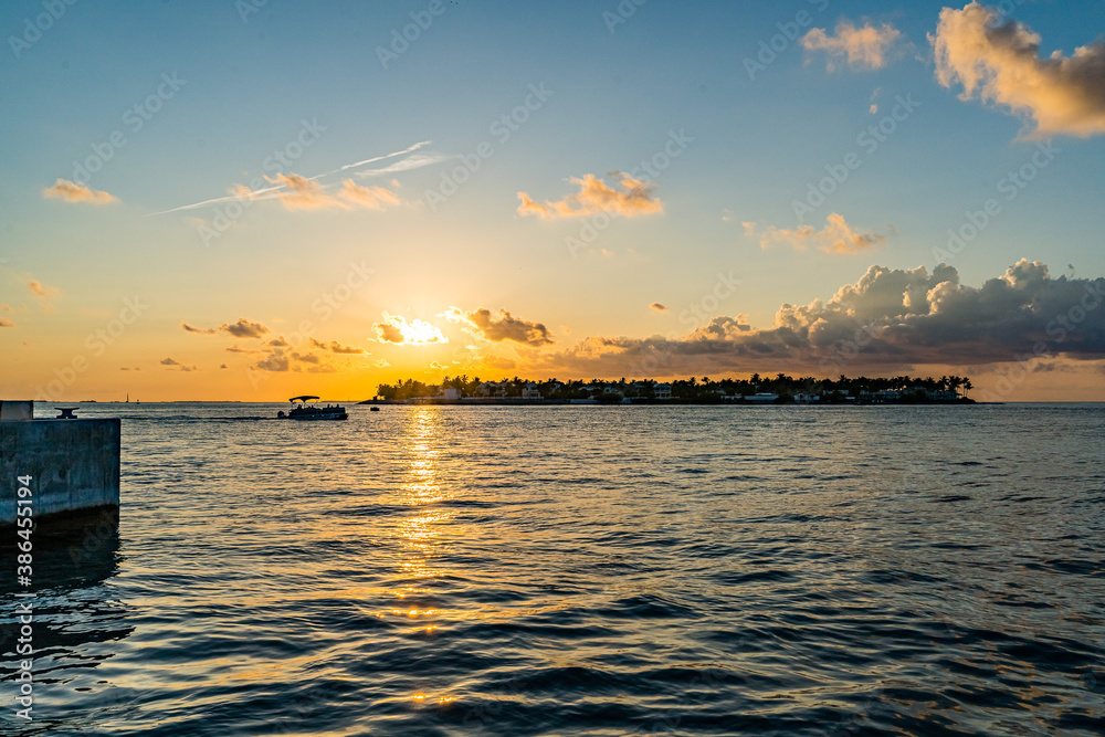 Sunset, view of Sunset y Island from Mallory Square, Key West, Florida, US