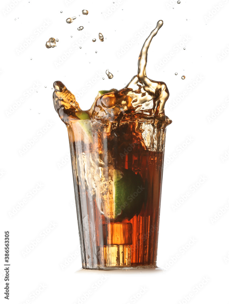 Glass of tasty Cuba Libre cocktail with splash on white background