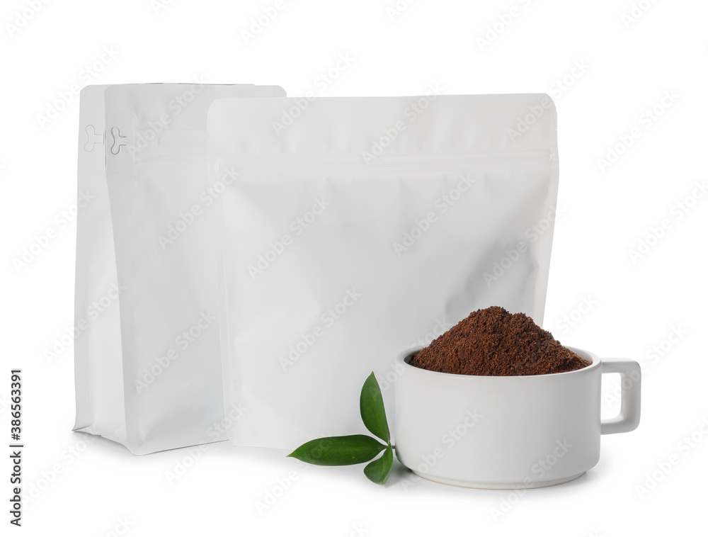 Blank coffee bags and cup on white background